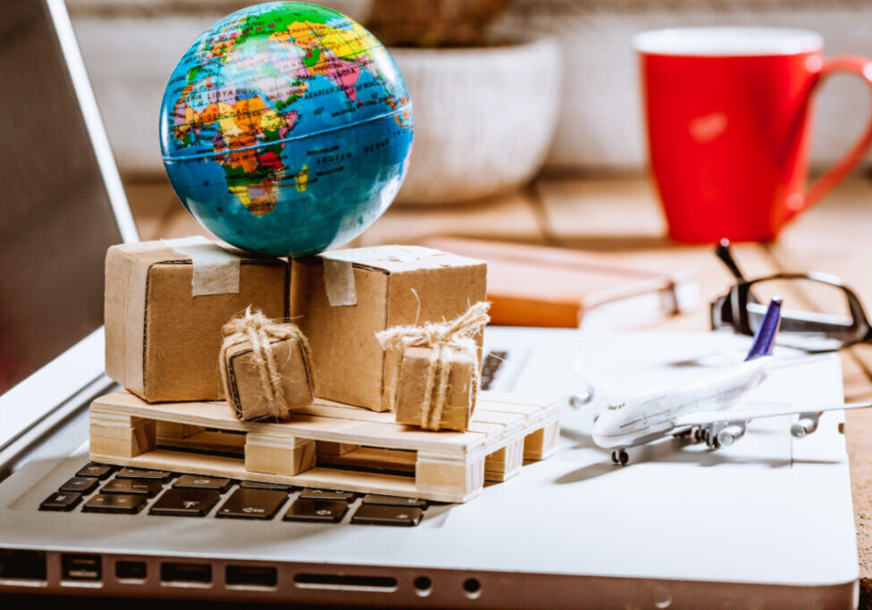 Global logistics concept with online trading and shopping in the internet, packages to be delivered after ordering on the computer