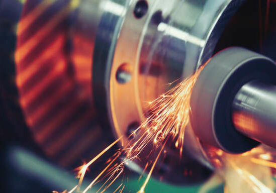 Finishing metal working on high precision grinding machine in factory