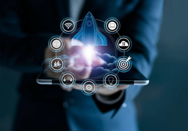 Startup concept. Businessman touching tablet and icon network connection with rocket flying out of screen on dark background